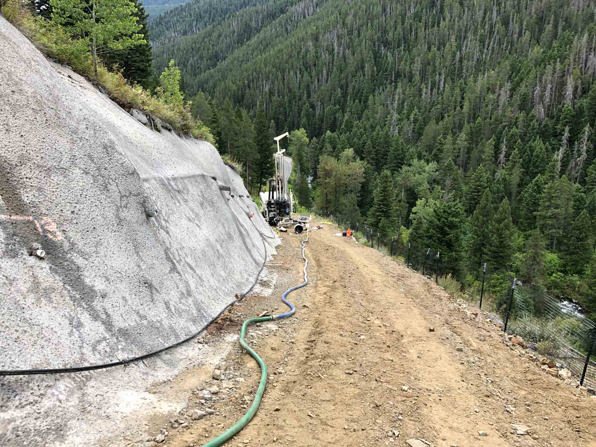 Hyalite Canyon Soil Nail Wall project with mountains in the background.