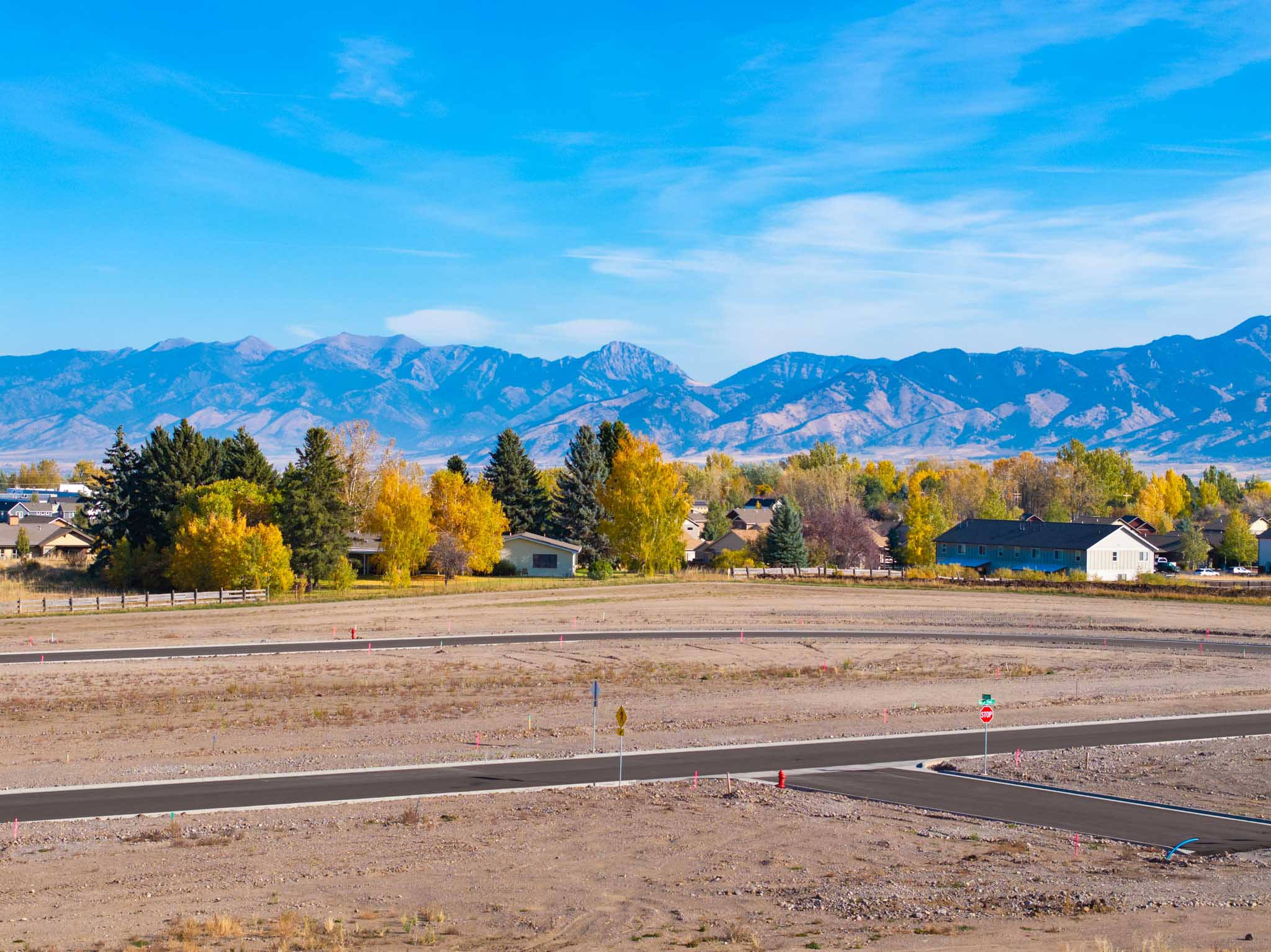 aerial view of the Sierra Vista Subdivision engineering project in late summer with Bozeman and Ross Peak in the background.