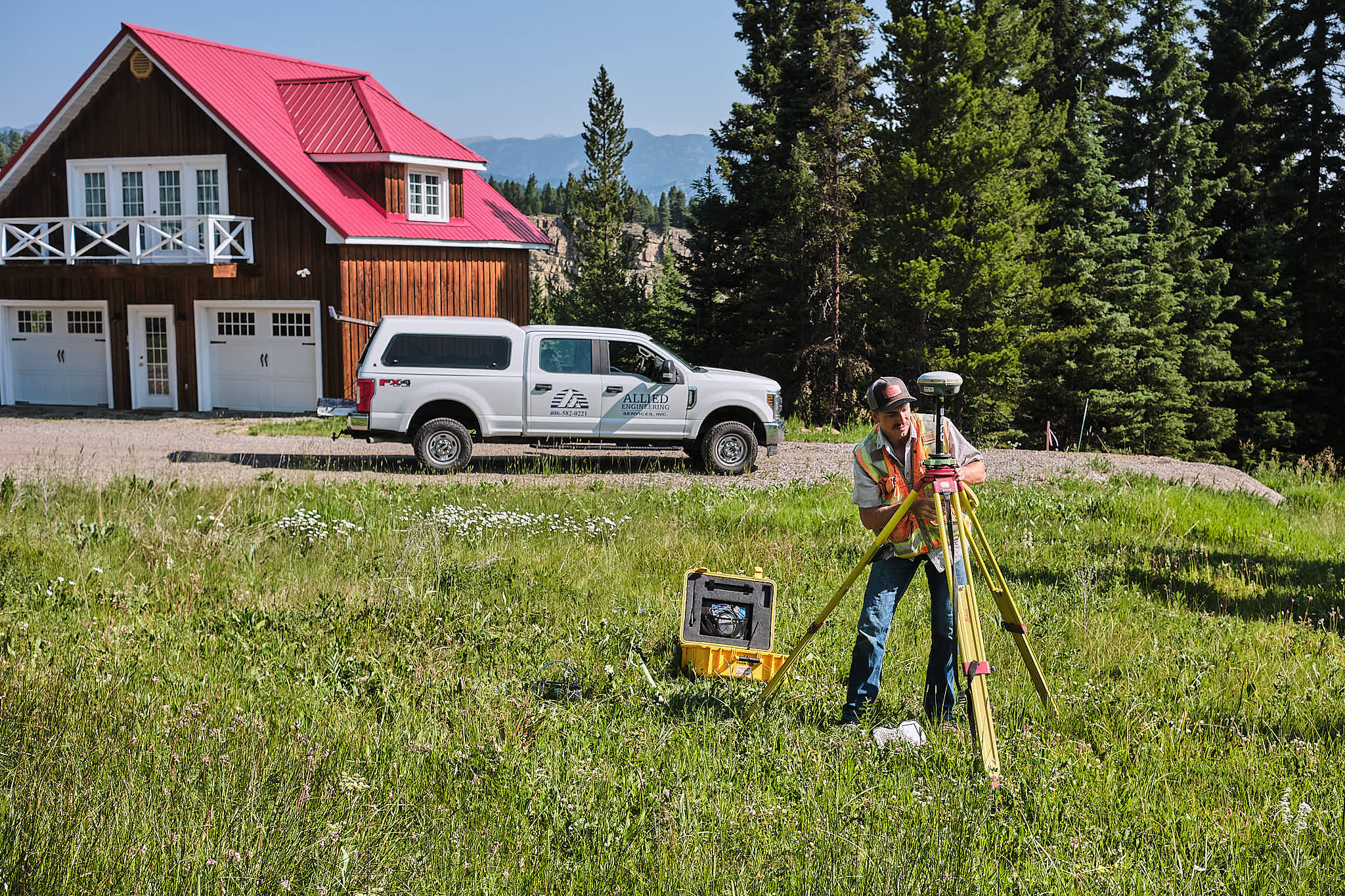 Allied Engineering surveyor taking measurements for a Big Sky engineering project.